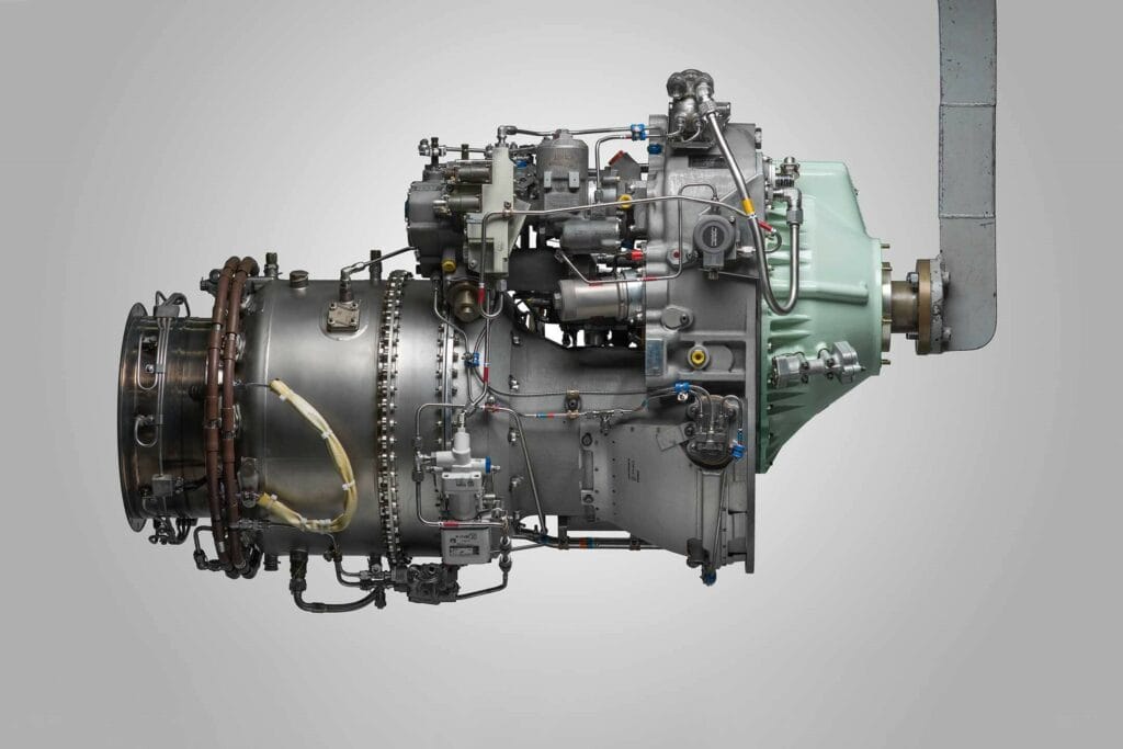 Honeywell TPE331 turboprop engine displayed in a side profile against a neutral background, highlighting its compact design, intricate fuel and control systems, and precision engineering for reliable aircraft performance.