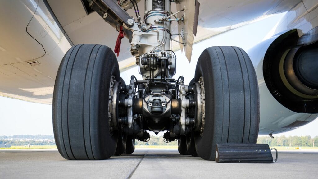 Close-up of an aircraft landing gear assembly highlighting rotable parts such as wheels, brakes, and structural components.