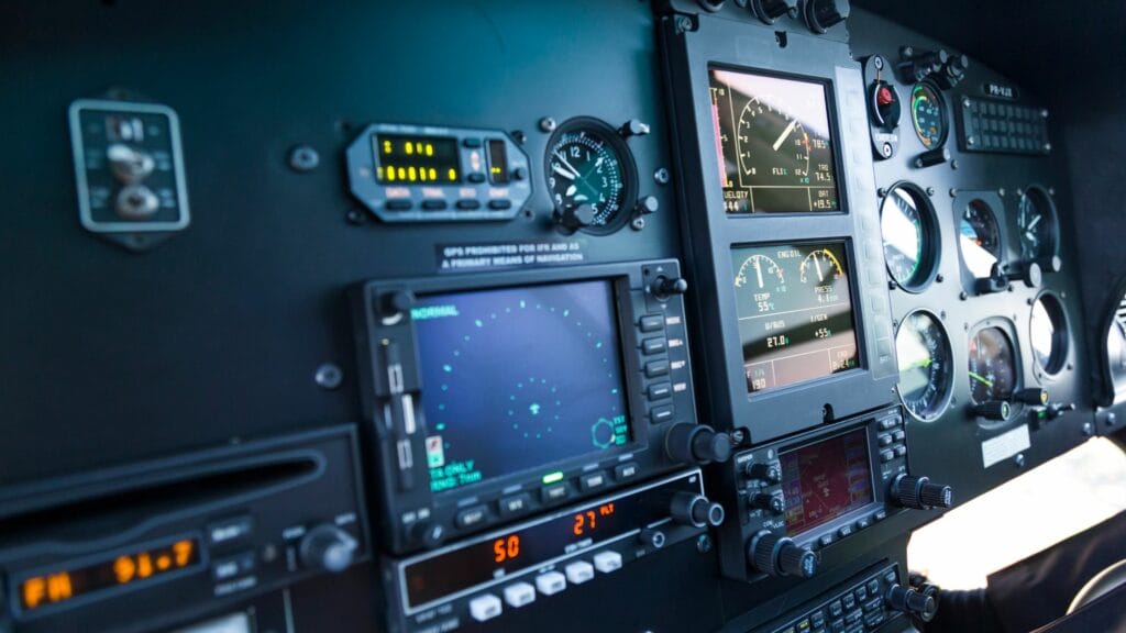 Detailed aircraft control panel inside cockpit.