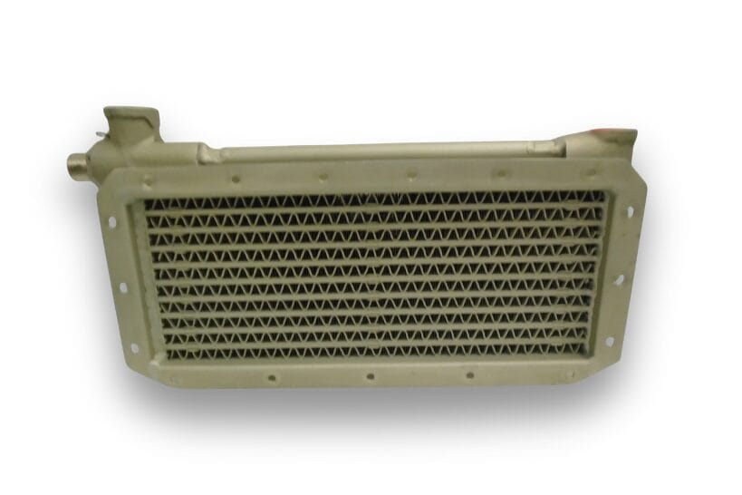 Close-up view of DK Turbines aircraft oil coolers on a white background